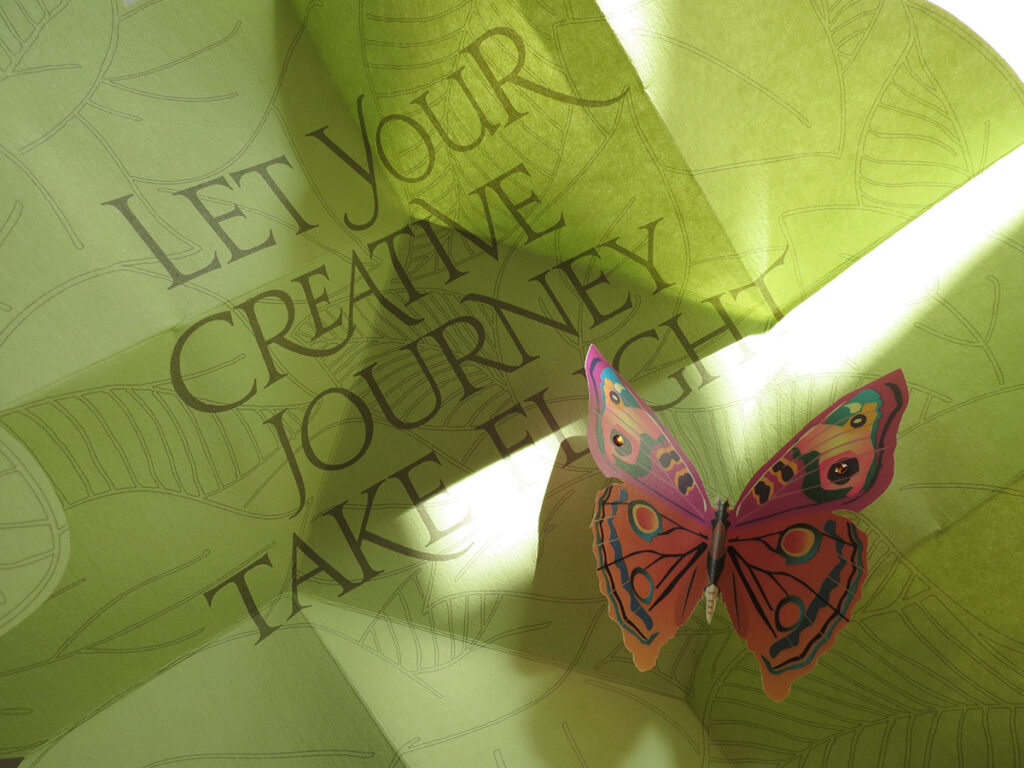 A Marcus Group Diecut Pop-up Butterfly mailer designed by Karen Hsin